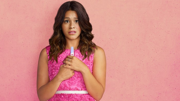 Gina Rodriguez holding pregnancy test