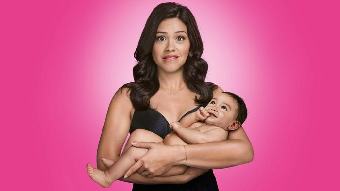 Gina Rodriguez holding a baby
