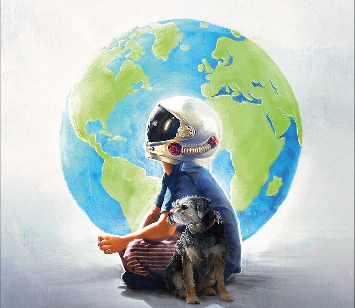 Boy in astronaut helmet with dog and Earth