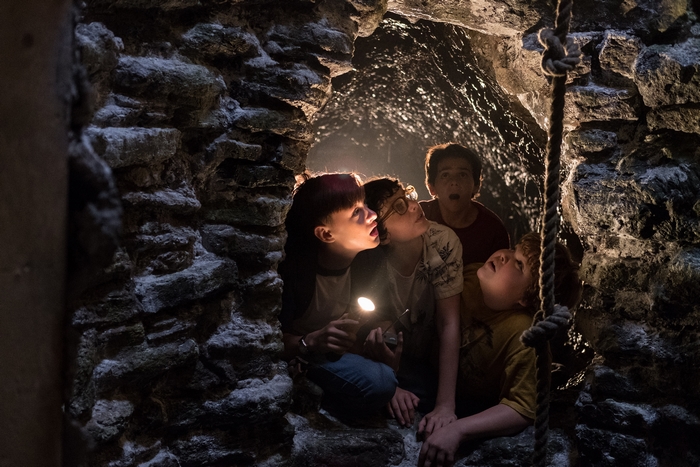 Jaeden Martell and friends in a cave