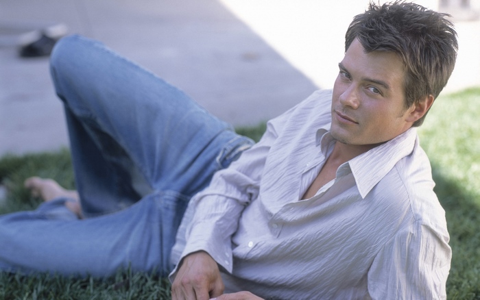 Josh Duhamel lying on grass