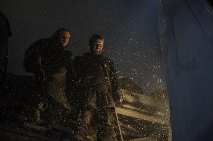 Two men in winter clothing in snow