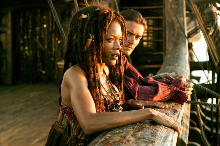 Naomie Harris and Orlando Bloom on a ship