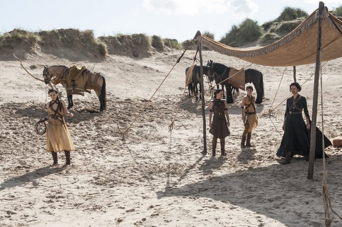 Rosabell Laurenti Sellers with horses on a beach