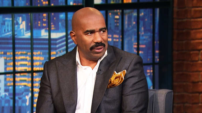 Steve Harvey on a talk show set
