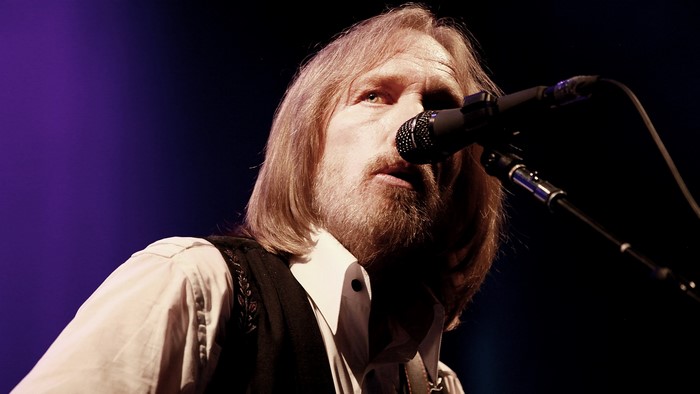 Tom Petty performing on stage