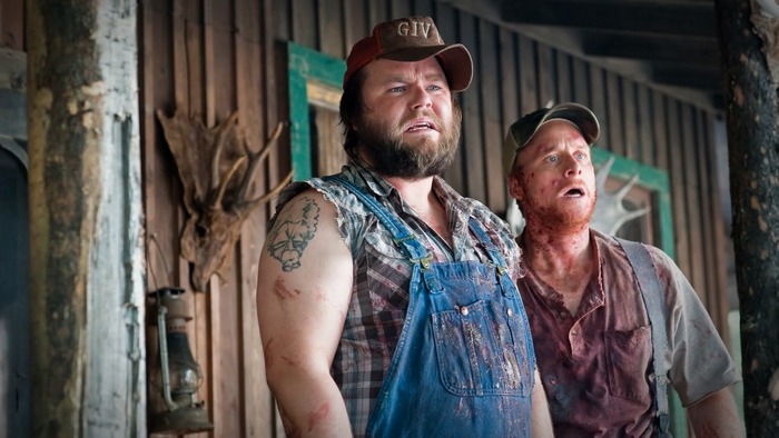 Alan Tudyk and another man in a cabin