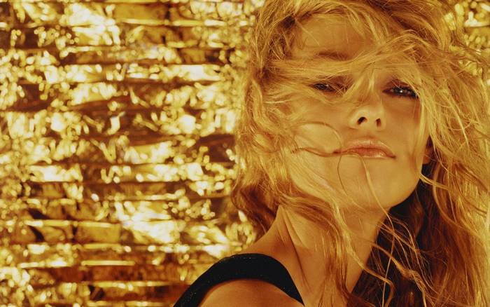 Vanessa Paradis against a golden background