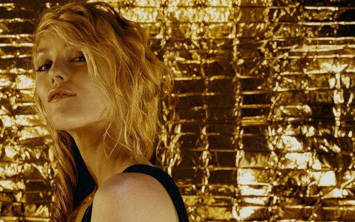 Vanessa Paradis against a gold background