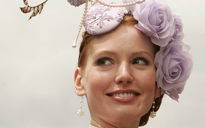 Alicia Witt wearing a floral hat