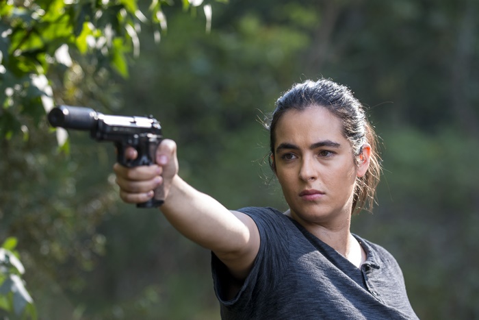 Alanna Masterson holding a gun
