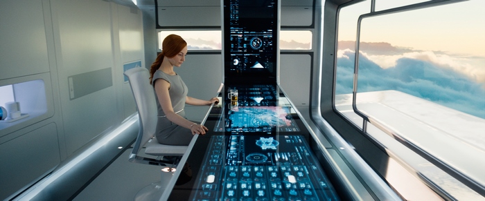 Andrea Riseborough in a futuristic control room