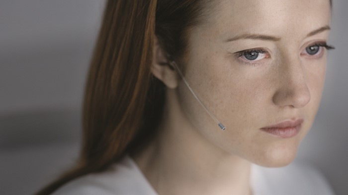 Andrea Riseborough with earpiece