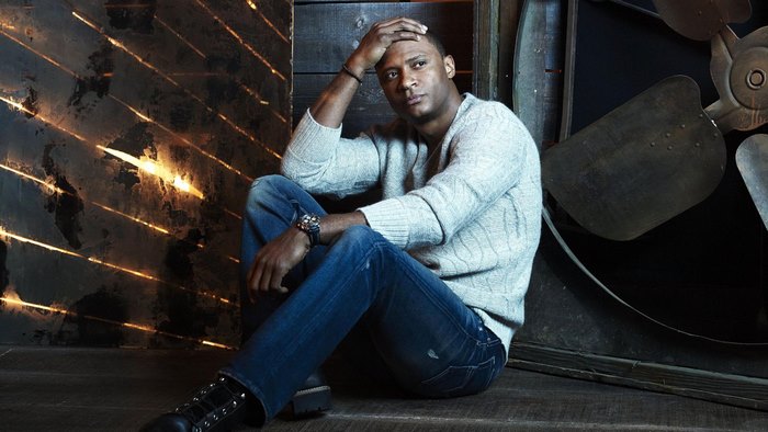 David Ramsey sitting on floor
