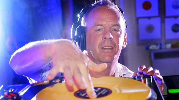 Fatboy Slim DJing with Headphones