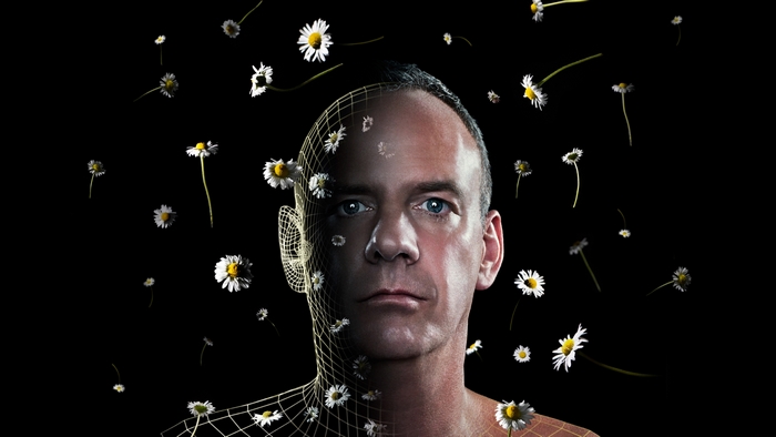 Fatboy Slim surrounded by daisies