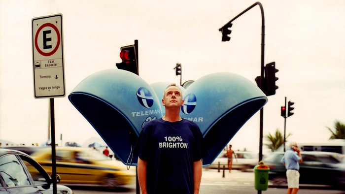 Fatboy Slim in front of phone booths