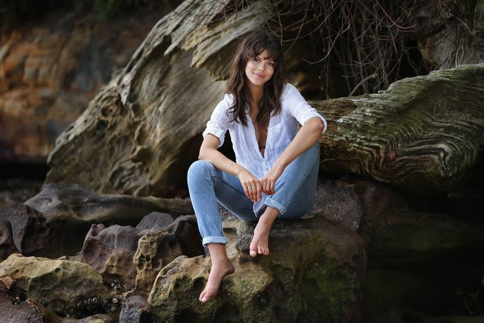 Georgia Fowler sitting on rocks