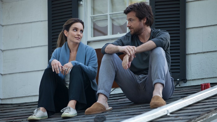 Jason Bateman and Tina Fey sitting on a roof