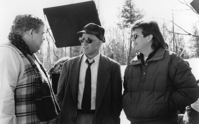 John Candy and two men on a film set
