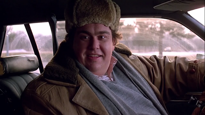 John Candy in a car