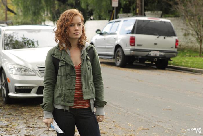 Jane Levy standing on a street
