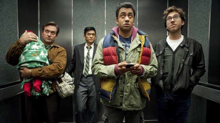 Four men and a baby in an elevator
