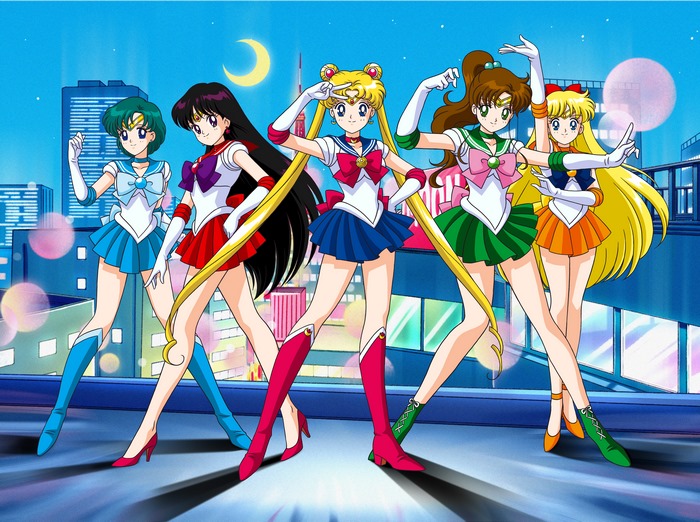 Sailor Moon characters posing on a rooftop