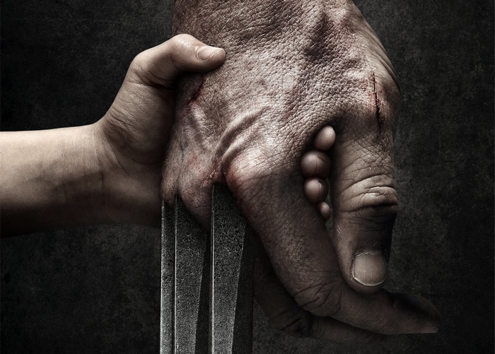 Wolverine holding a child's hand