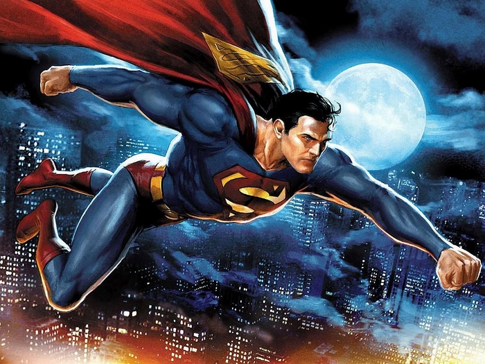 Superman flying over a city at night