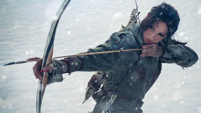Lara Croft aiming a bow and arrow in the snow