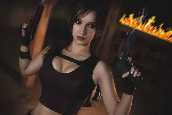 Lara Croft holding two pistols with fire