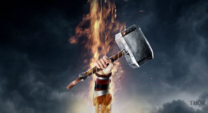Thor holding Mjolnir with fire and clouds