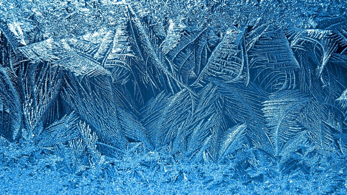 Close-up of frost patterns on glass