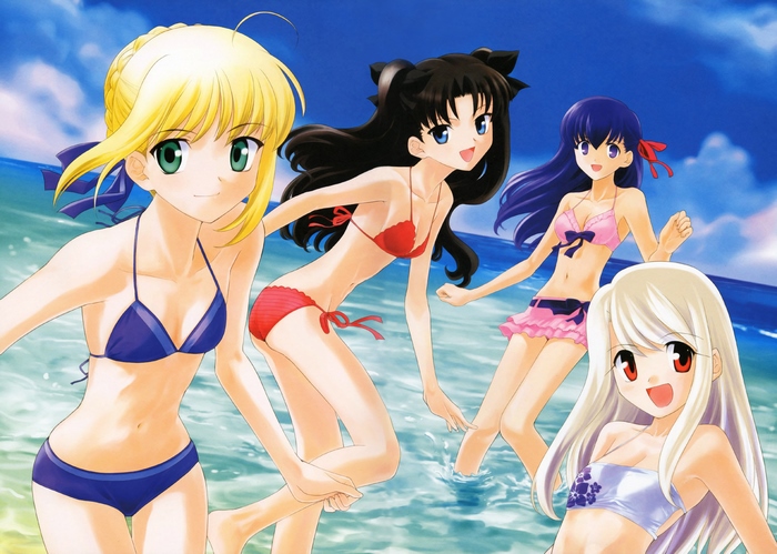 Four girls in swimsuits at the beach