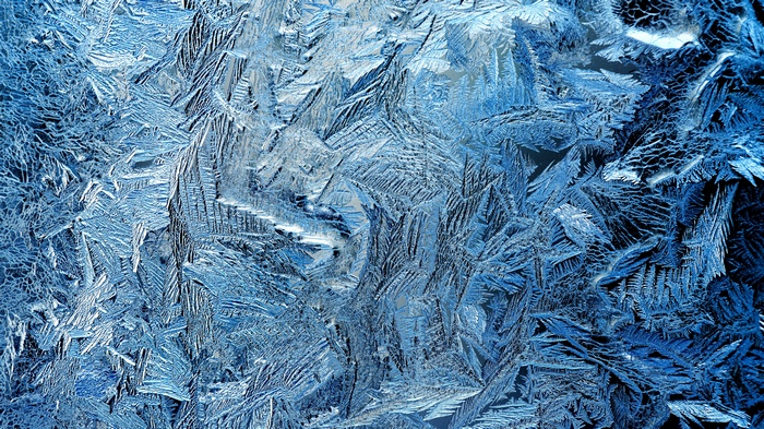 Close-up of frost patterns on glass