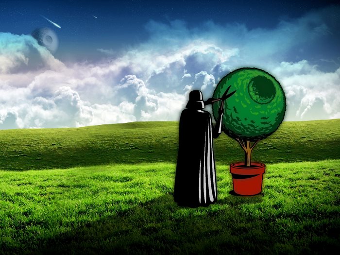 Darth Vader pruning a topiary tree
