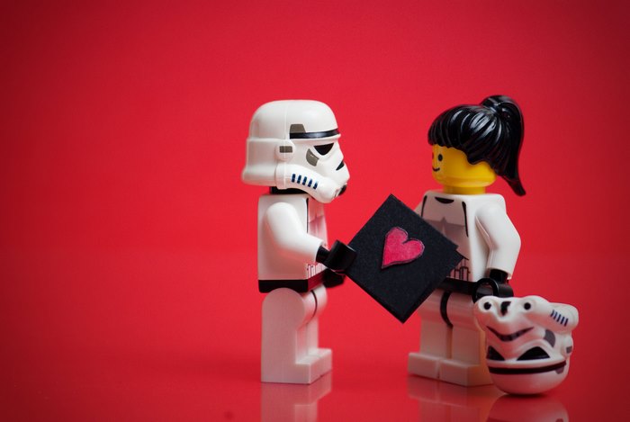 Stormtrooper giving a heart card to another Stormtrooper