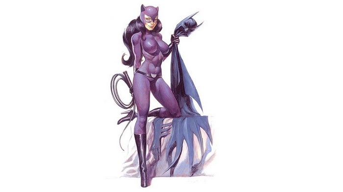 Catwoman holding Batman's cowl and cape