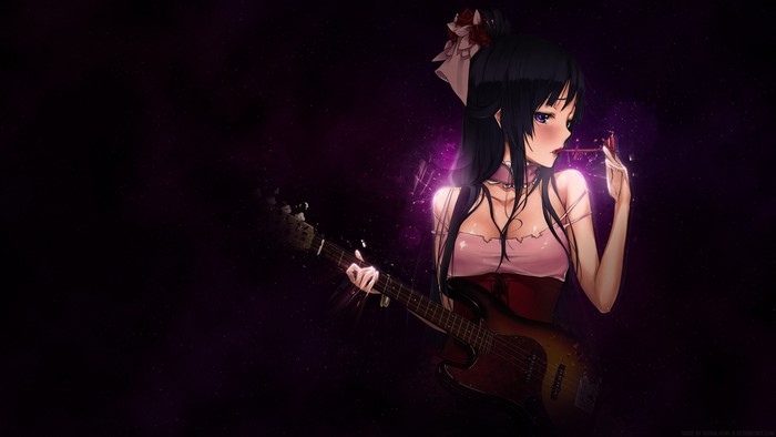 Mio Akiyama playing bass guitar