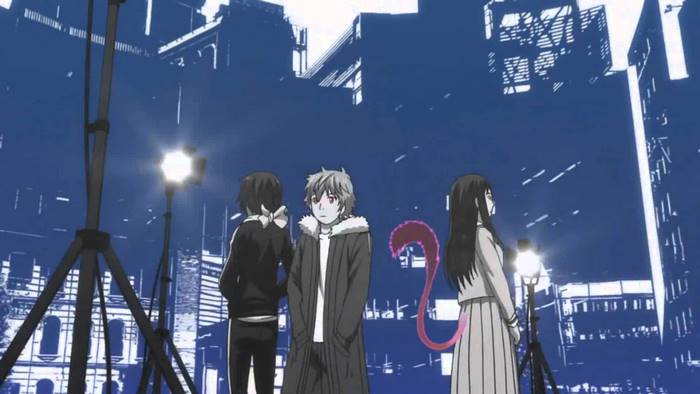 Yato and companions in a city at night