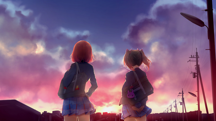 Two girls watching sunset