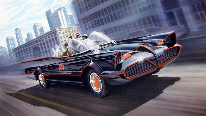 Robin and Batman driving the Batmobile