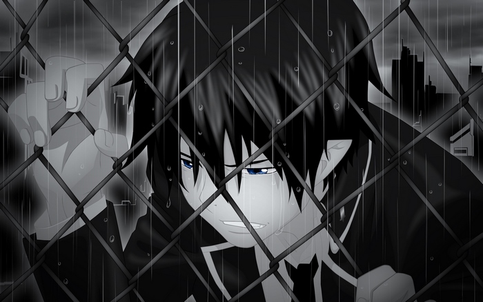 Rin Okumura behind a fence in the rain