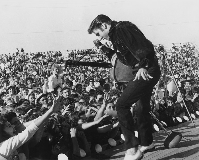 Elvis Presley performing for a crowd