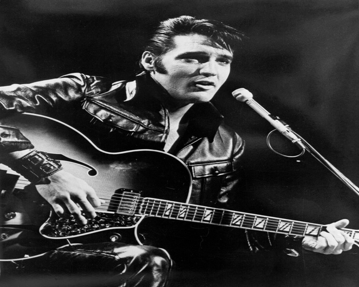 Elvis Presley playing guitar