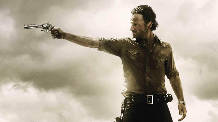 Rick Grimes from The Walking Dead holding a gun
