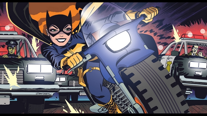 Batgirl on a motorcycle pursued by police cars