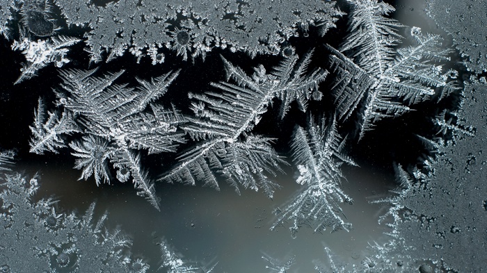 Close-up of frost patterns on glass
