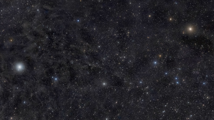 Starry night sky with nebulae and galaxies
